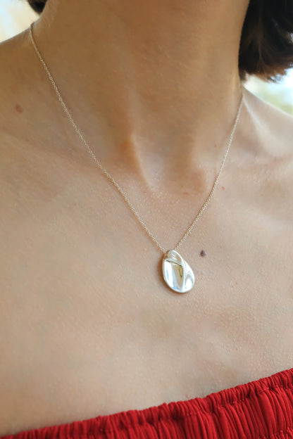 Elsa Peretti for Tiffany & Co. sterling silver Madonna pendant necklace: close-up detail of the sculpted Madonna pendant highlighting the fine silverwork and silhouette design