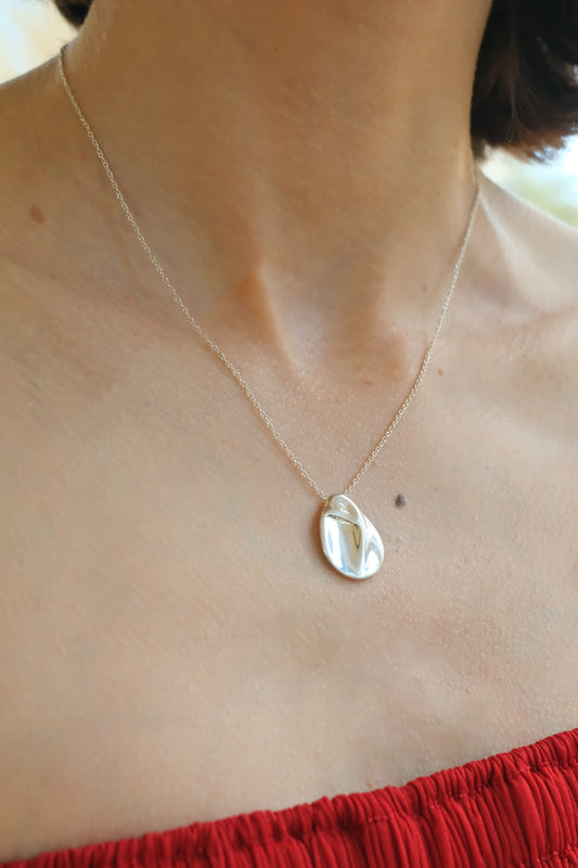 Elsa Peretti for Tiffany & Co. sterling silver Madonna pendant necklace: close-up detail of the sculpted Madonna pendant highlighting the fine silverwork and silhouette design