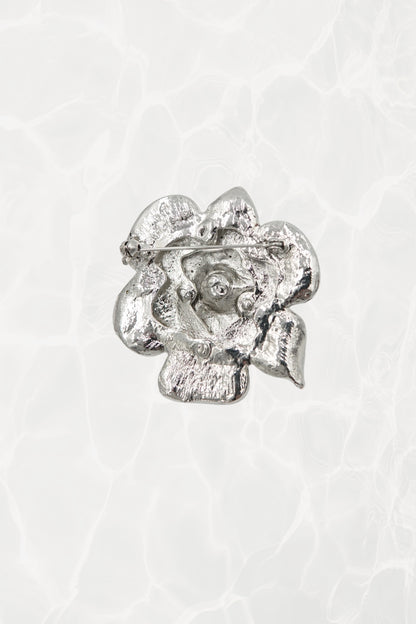 Rhinestone flower brooch — back view showing pin mechanism