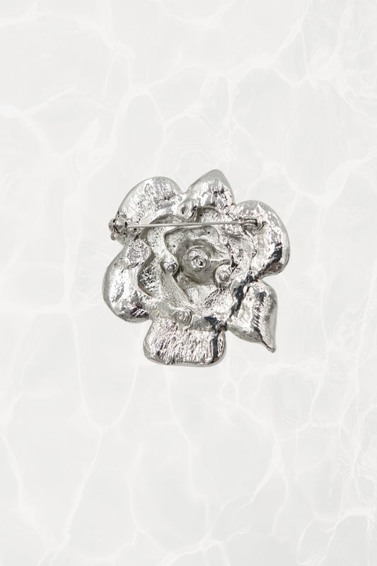 Rhinestone flower brooch — back view showing pin mechanism