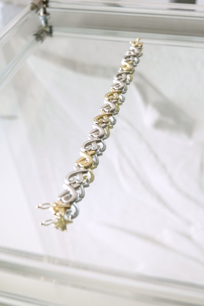 Paloma Picasso for Tiffany & Co. Loving Heart link bracelet: side profile view displaying the elegant curved heart links and secure box clasp closure