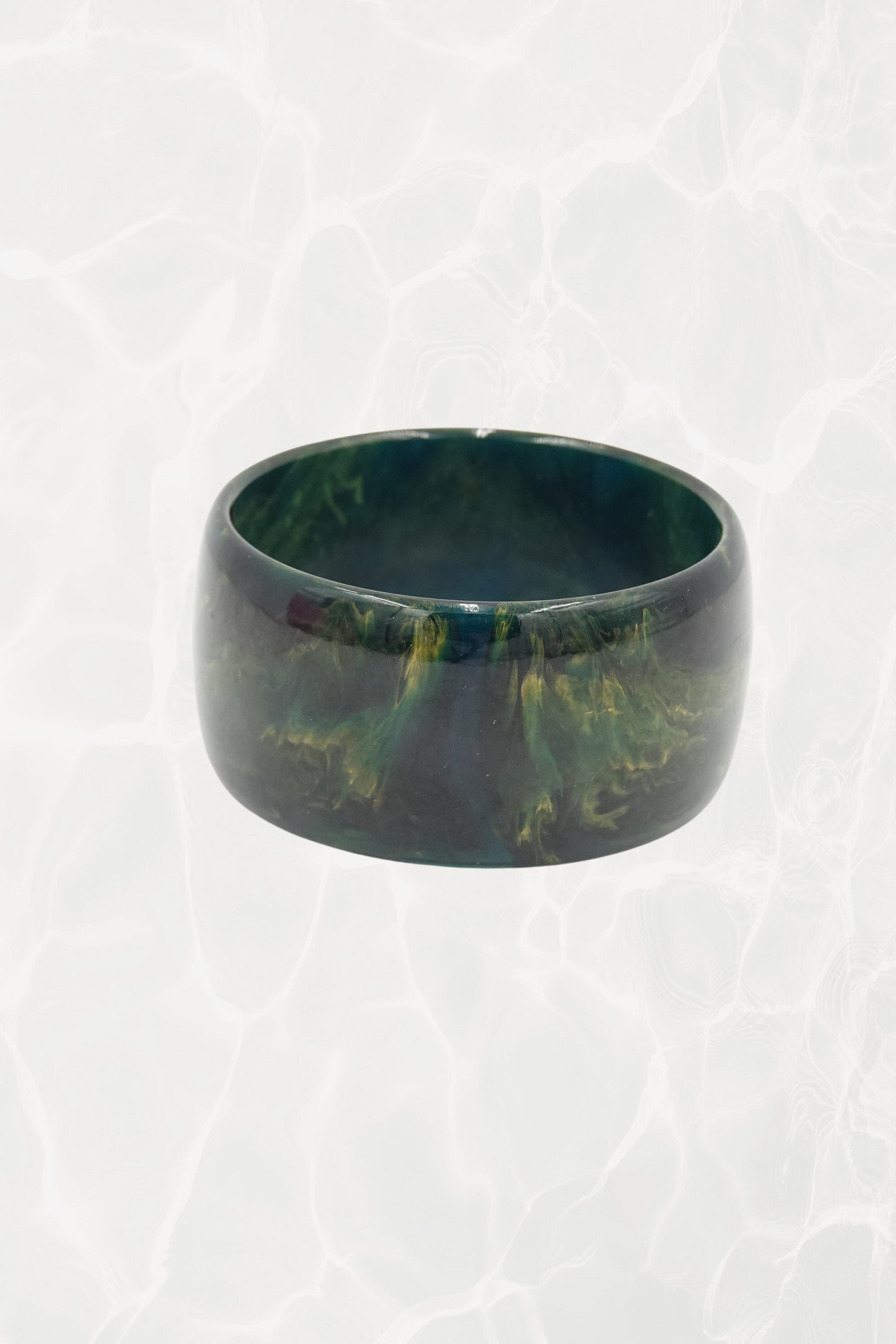 Deep green marbled wide bangle — front view