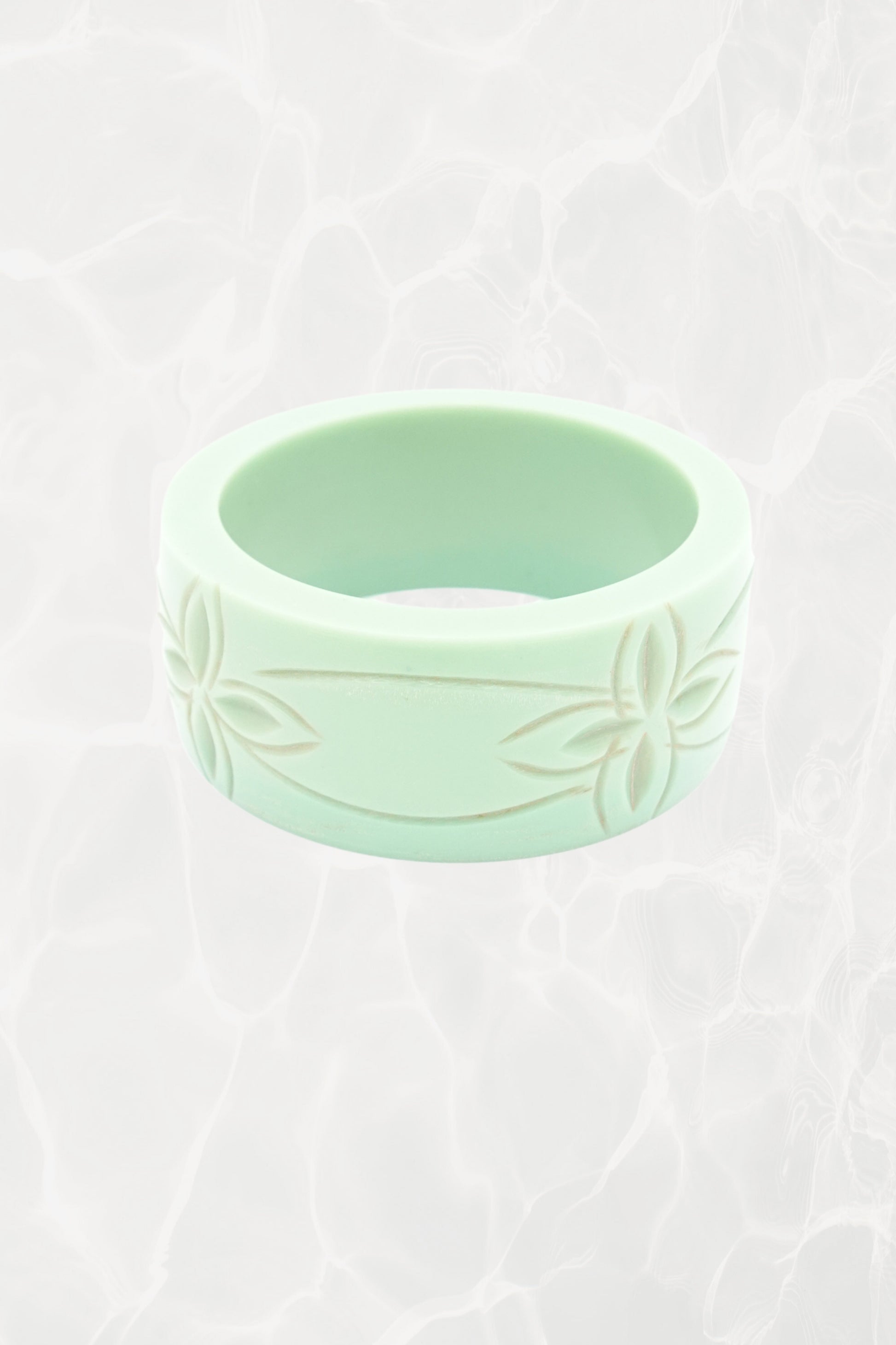 Carved mint green Bakelite bangle — hero front view
