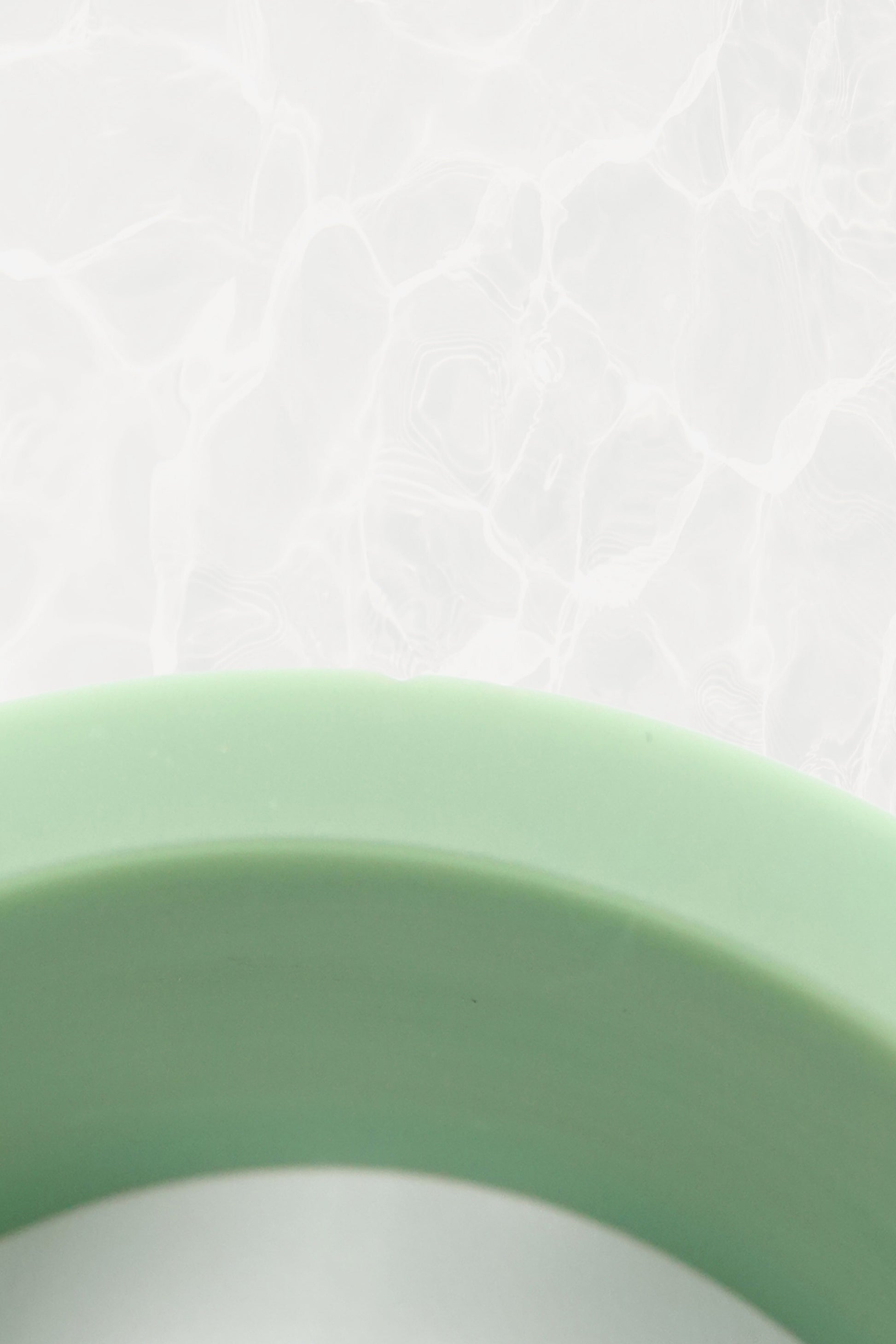 Mint green Bakelite bangle — close-up of carved botanical pattern