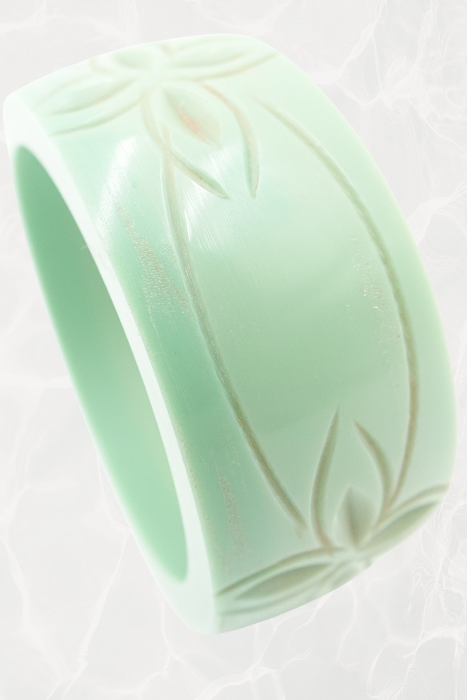 Carved celadon Bakelite bangle — top-down view