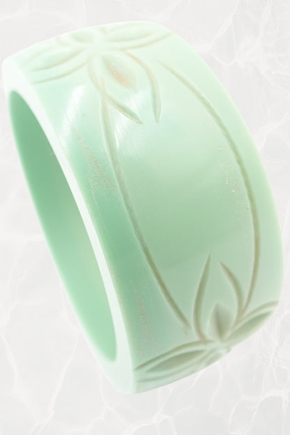 Carved celadon Bakelite bangle — top-down view