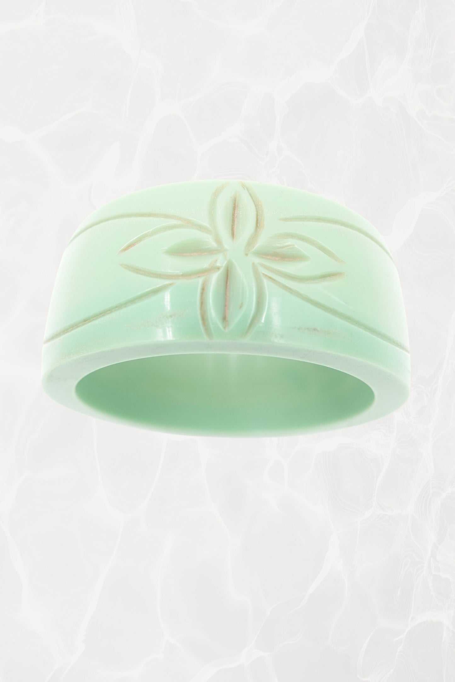 Carved mint green Bakelite bangle — reverse angle