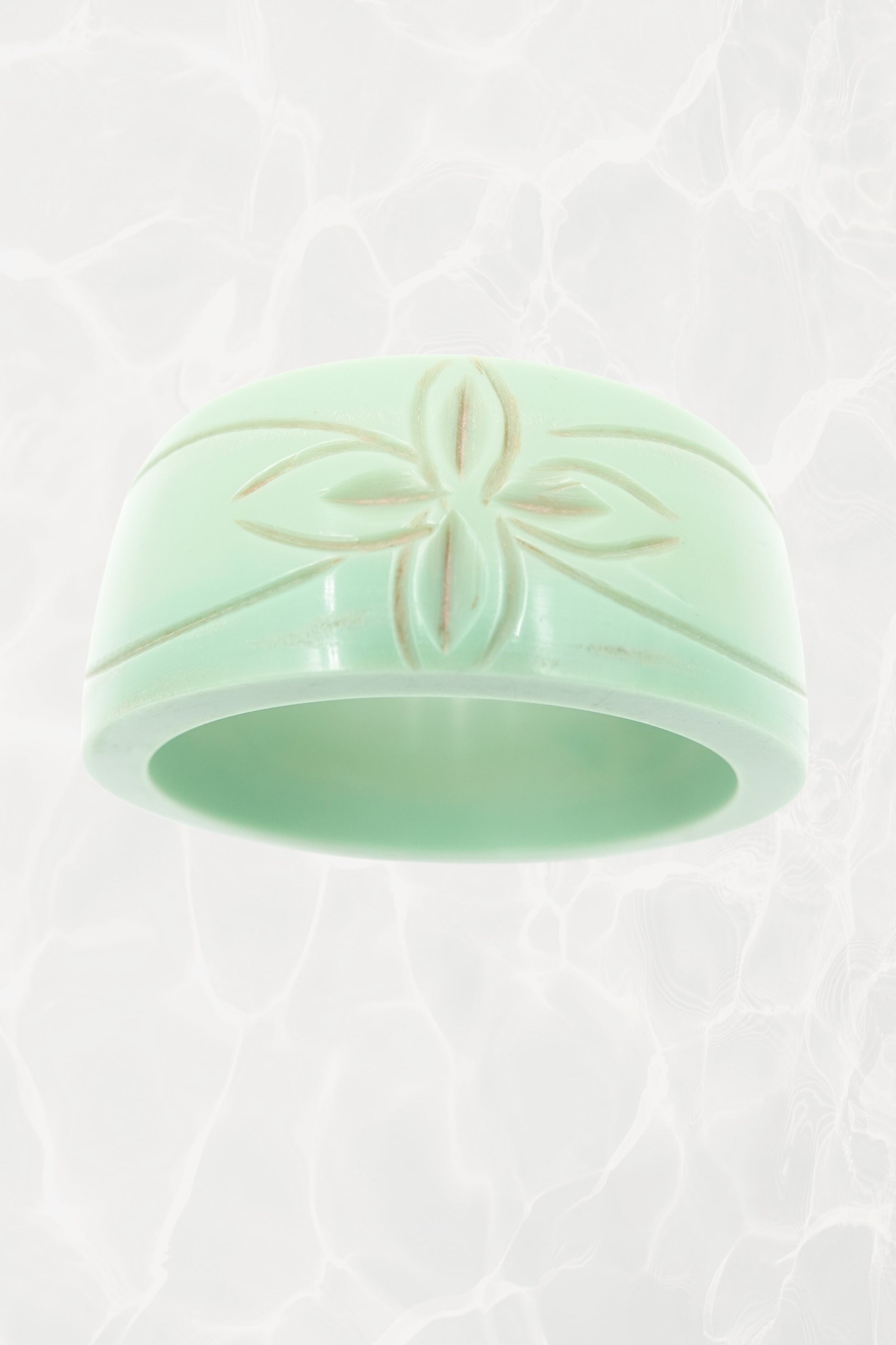 Carved mint green Bakelite bangle — reverse angle