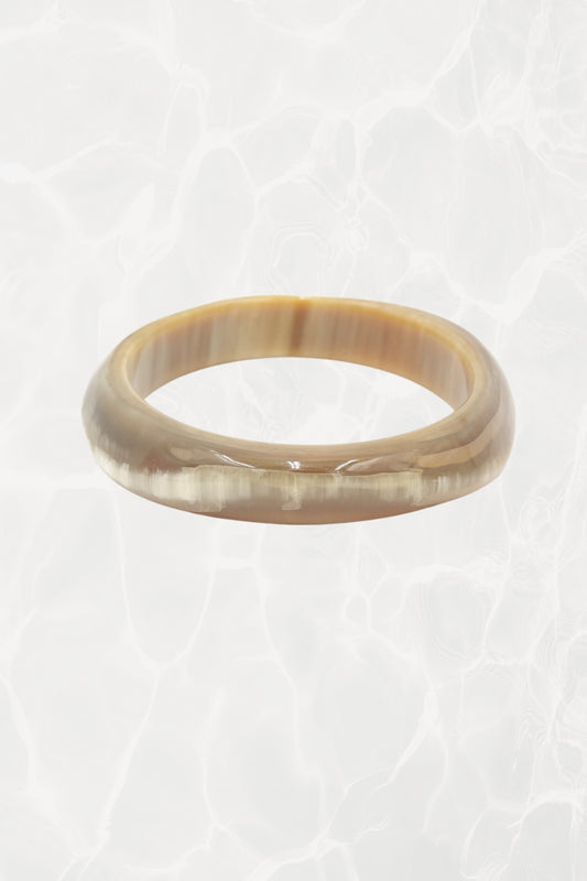 Natural horn bangle — front view showing warm amber striations