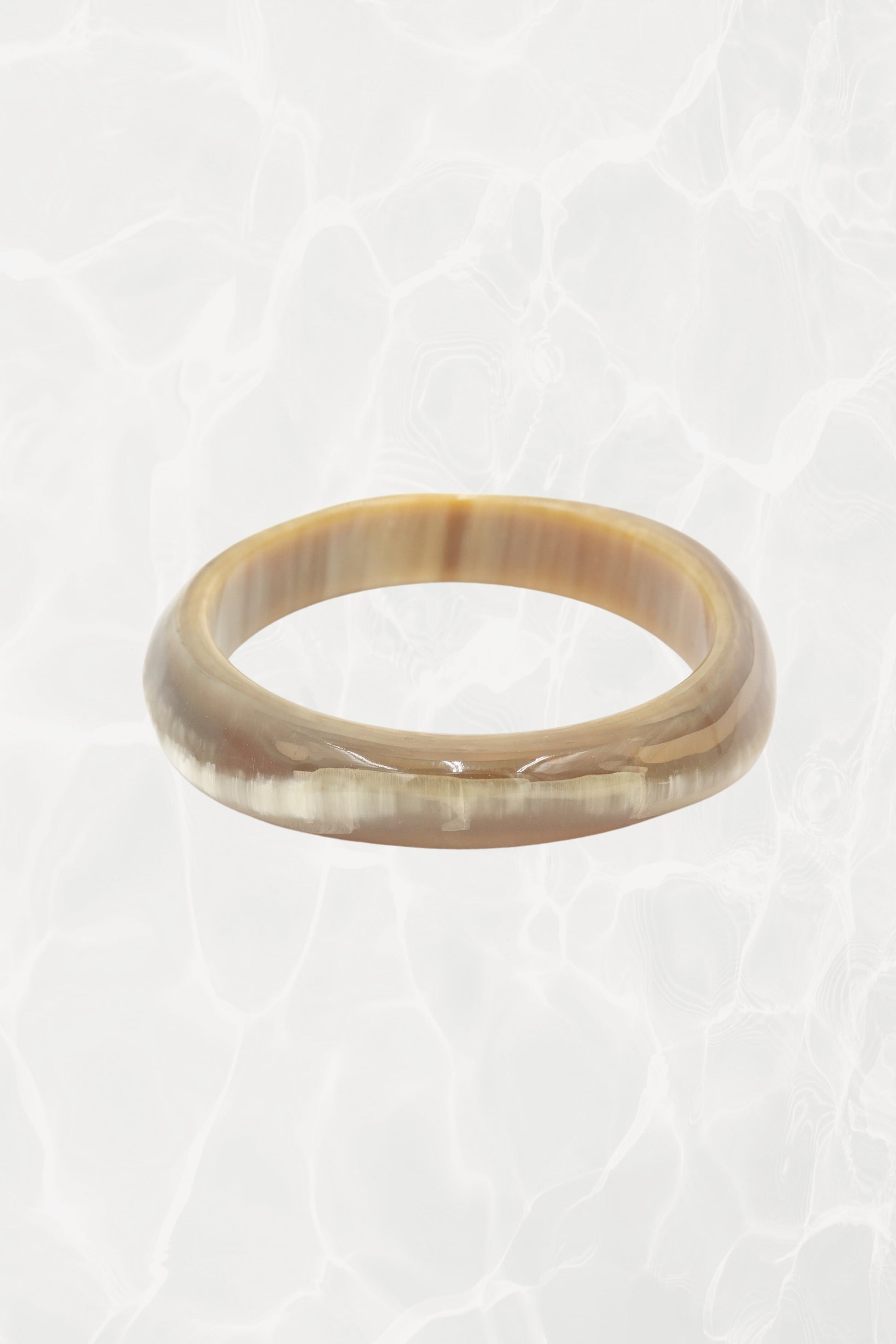 Polished horn bangle — three-quarter view