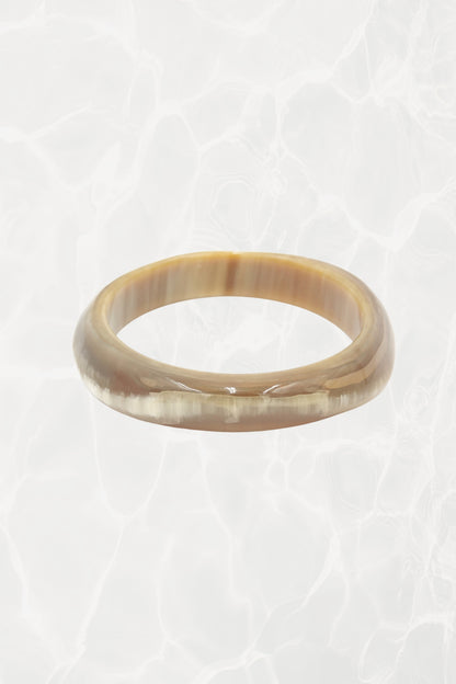 Polished horn bangle — three-quarter view