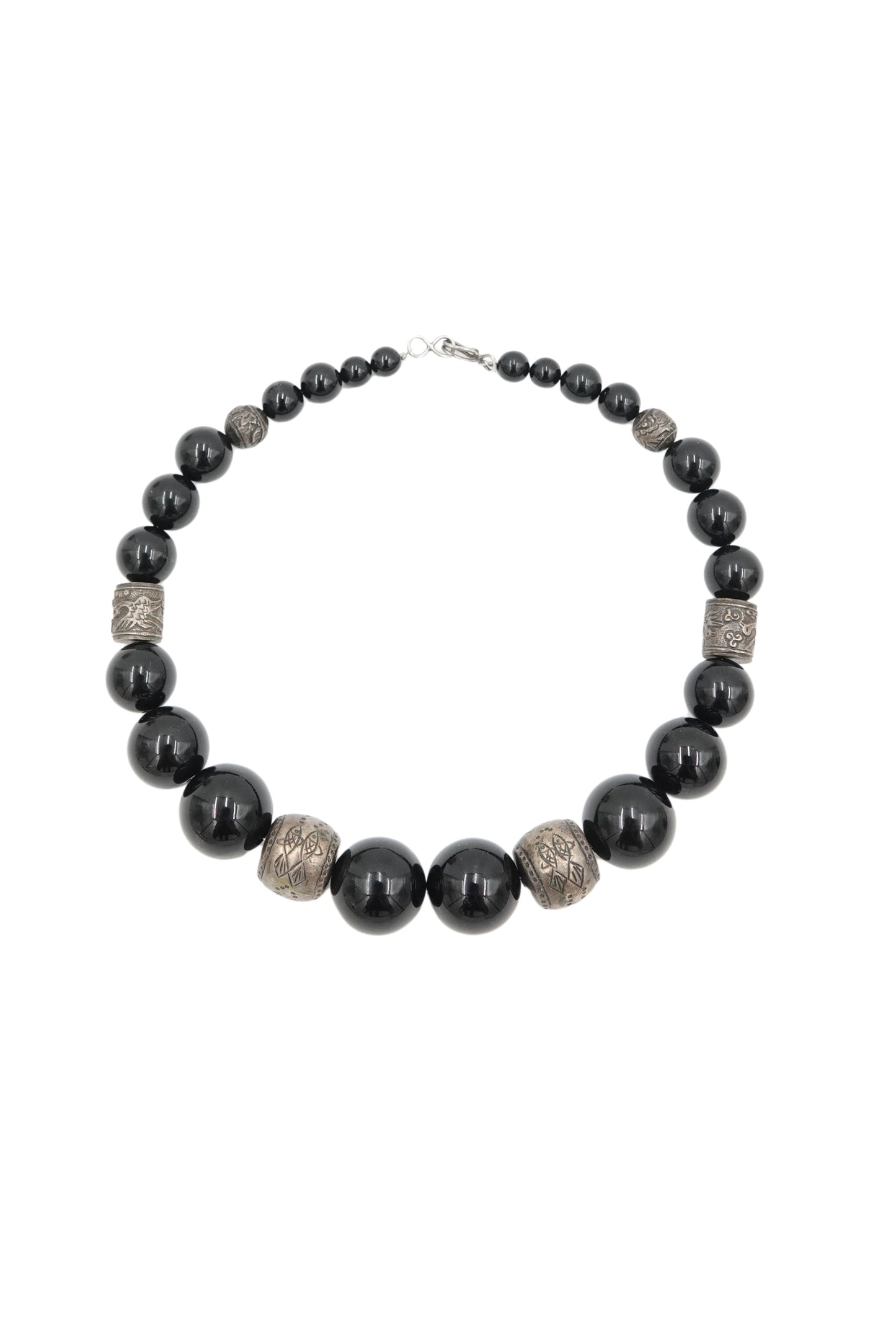Vintage 1980s black onyx beaded necklace with engraved silver spacers — full length on white