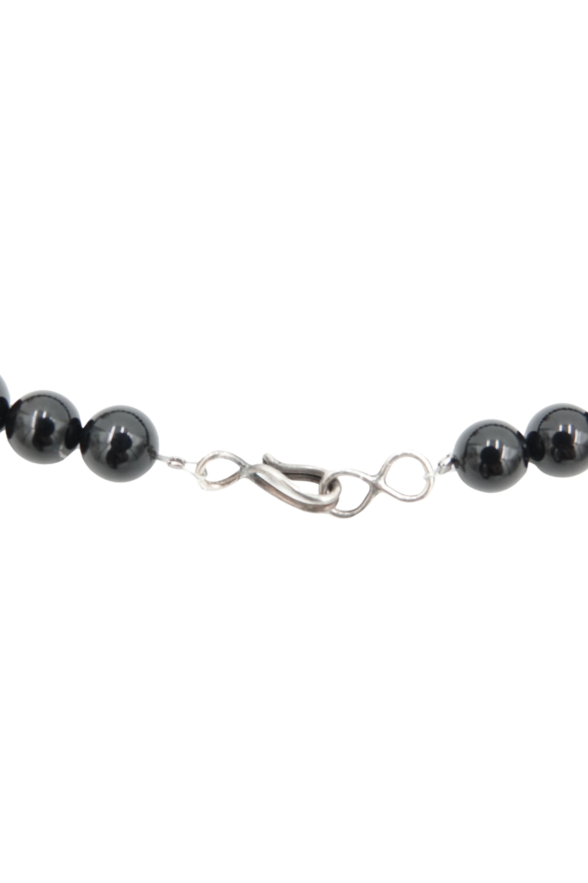 Vintage 1980s black onyx beaded necklace — close-up of graduated bead sizing