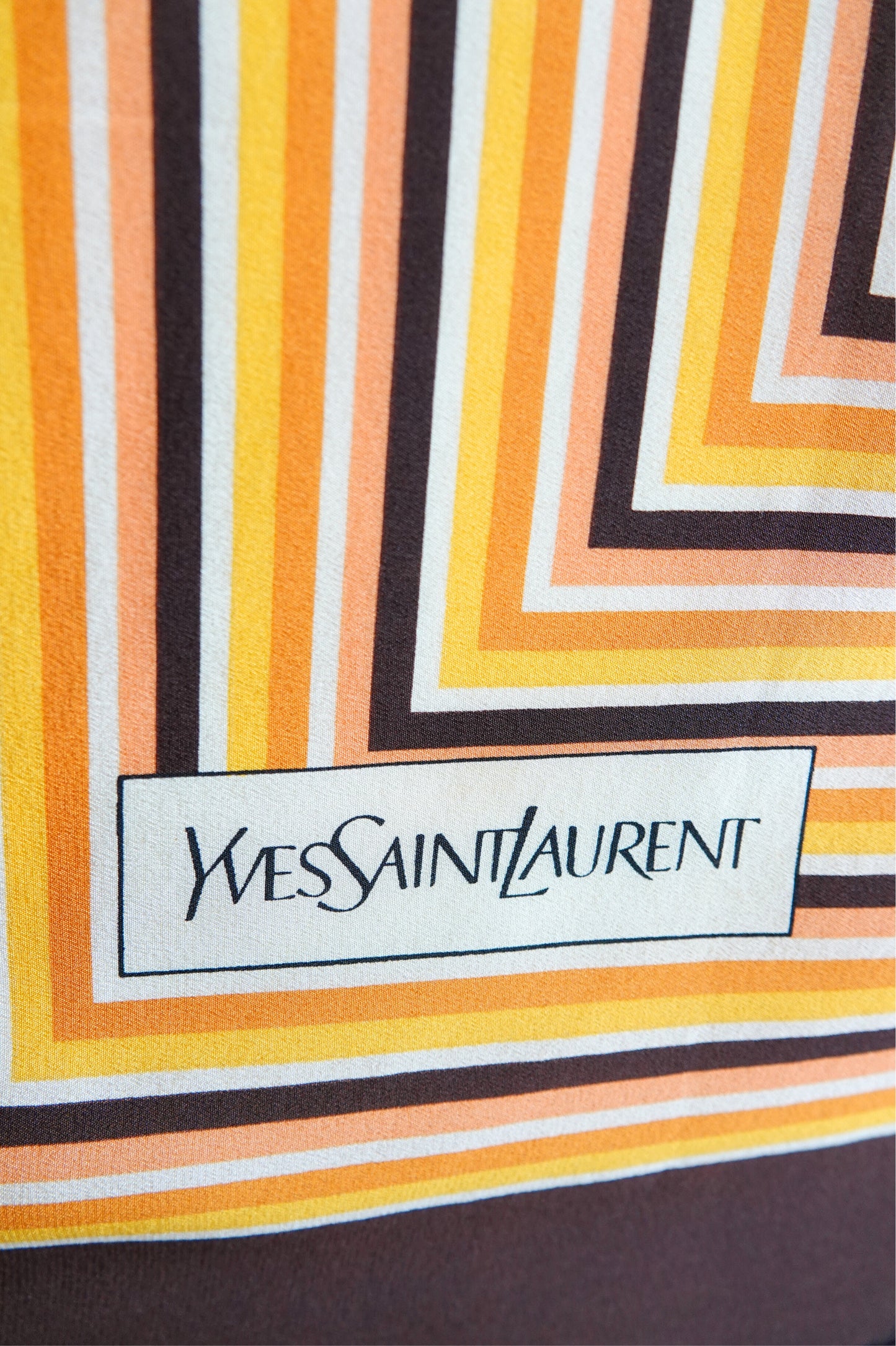 1970s YSL Yves Saint Laurent silk scarf: center field detail showing the ivory background with subtle inner square stripe pattern and bold outer border