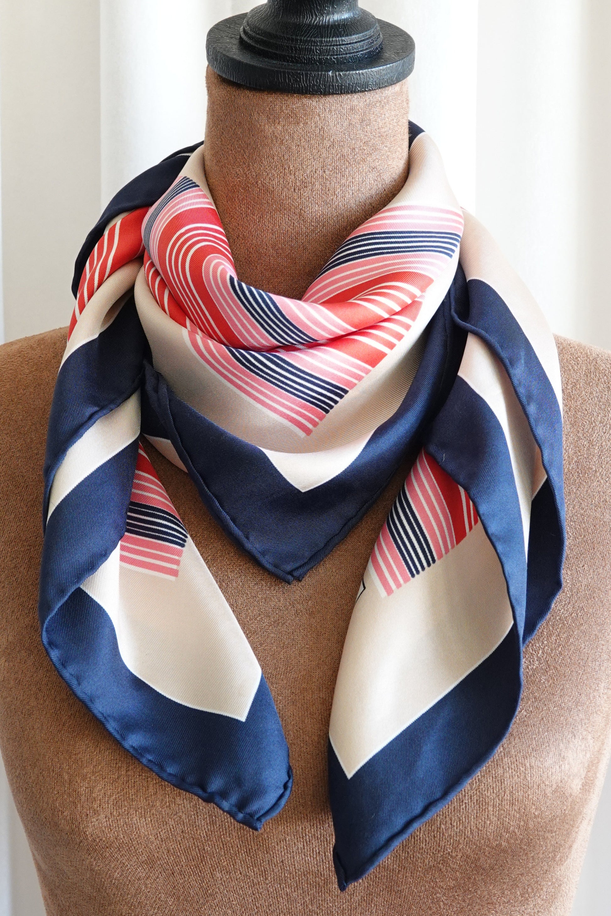 Late 1970s early 1980s YSL Yves Saint Laurent silk scarf: draped view showing the fluid movement of the silk fabric and how the geometric stripe pattern falls