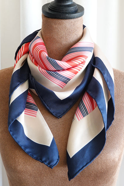 Late 1970s early 1980s YSL Yves Saint Laurent silk scarf: draped view showing the fluid movement of the silk fabric and how the geometric stripe pattern falls