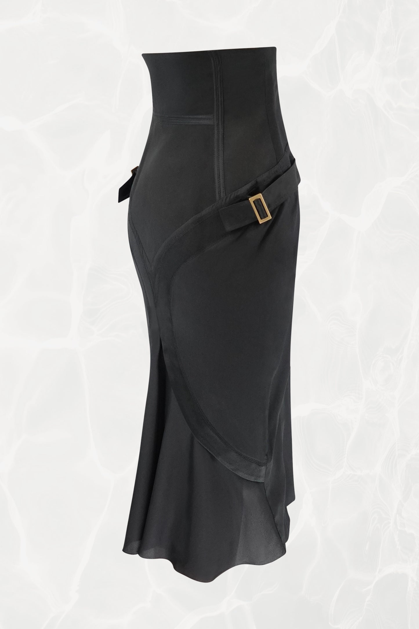 Tom Ford for Gucci FW03 black silk skirt three-quarter view: diagonal strap detail across hip with gold-tone square buckle hardware, corset waist, bias-cut flared hem, Fall 2003