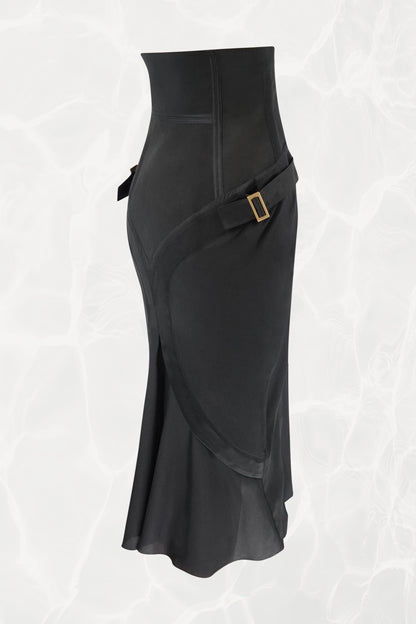Tom Ford for Gucci FW03 black silk skirt three-quarter view: diagonal strap detail across hip with gold-tone square buckle hardware, corset waist, bias-cut flared hem, Fall 2003