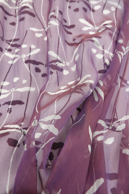 Chanel 98P dragonfly print fabric close-up: iridescent mauve silk chiffon overlay with white dragonfly and botanical stem motifs, layered over matching base fabric, Spring 1998