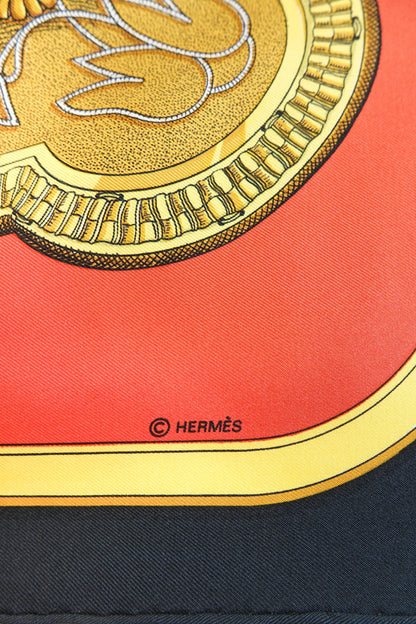 Hermès Grand Apparat Carré 90 gold medallion detail with © HERMÈS signature on red silk twill, archive condition