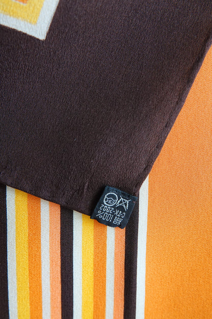 1970s YSL Yves Saint Laurent silk scarf: folded view showing the scarf styled as a neckerchief highlighting how the square stripe print reads when worn