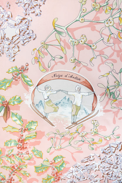 Hermès Neige d'Antan Carré 90 central medallion: "Neige d'Antan" cartouche with two ice skaters, mistletoe, holly and snowflake motifs on pink silk twill