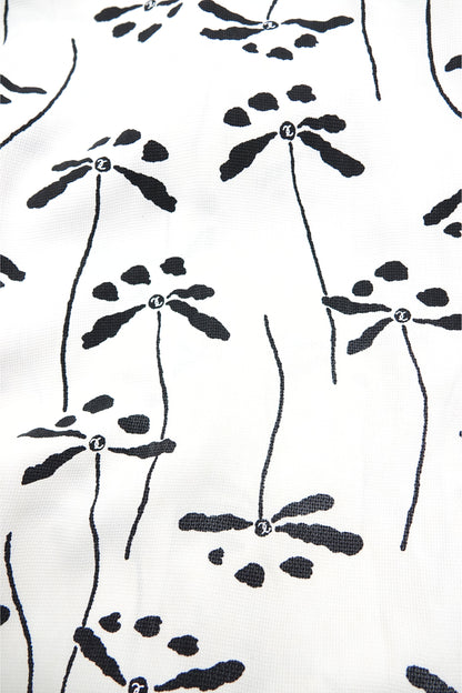 Chanel 98P dragonfly print base fabric close-up: black dragonfly and botanical stem print on white woven base fabric, shown flat, Chanel Spring 1998 print detail