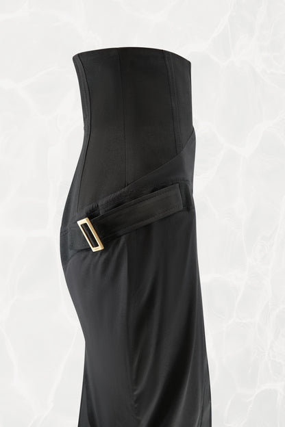 Tom Ford for Gucci FW03 black silk skirt detail: close-up of corset high waist, side strap with gold-tone rectangular buckle hardware crossing hip, bias-cut silk below, Fall 2003