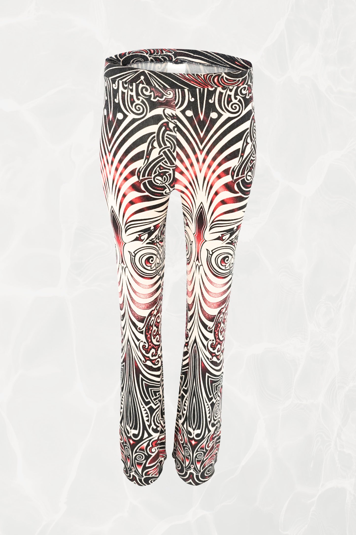 Jean Paul Gaultier JPG Jeans SS96 Cyberbaba pull-on pants front view: full-length jersey knit trousers with tribal tattoo print in black, white and red, circa 1996