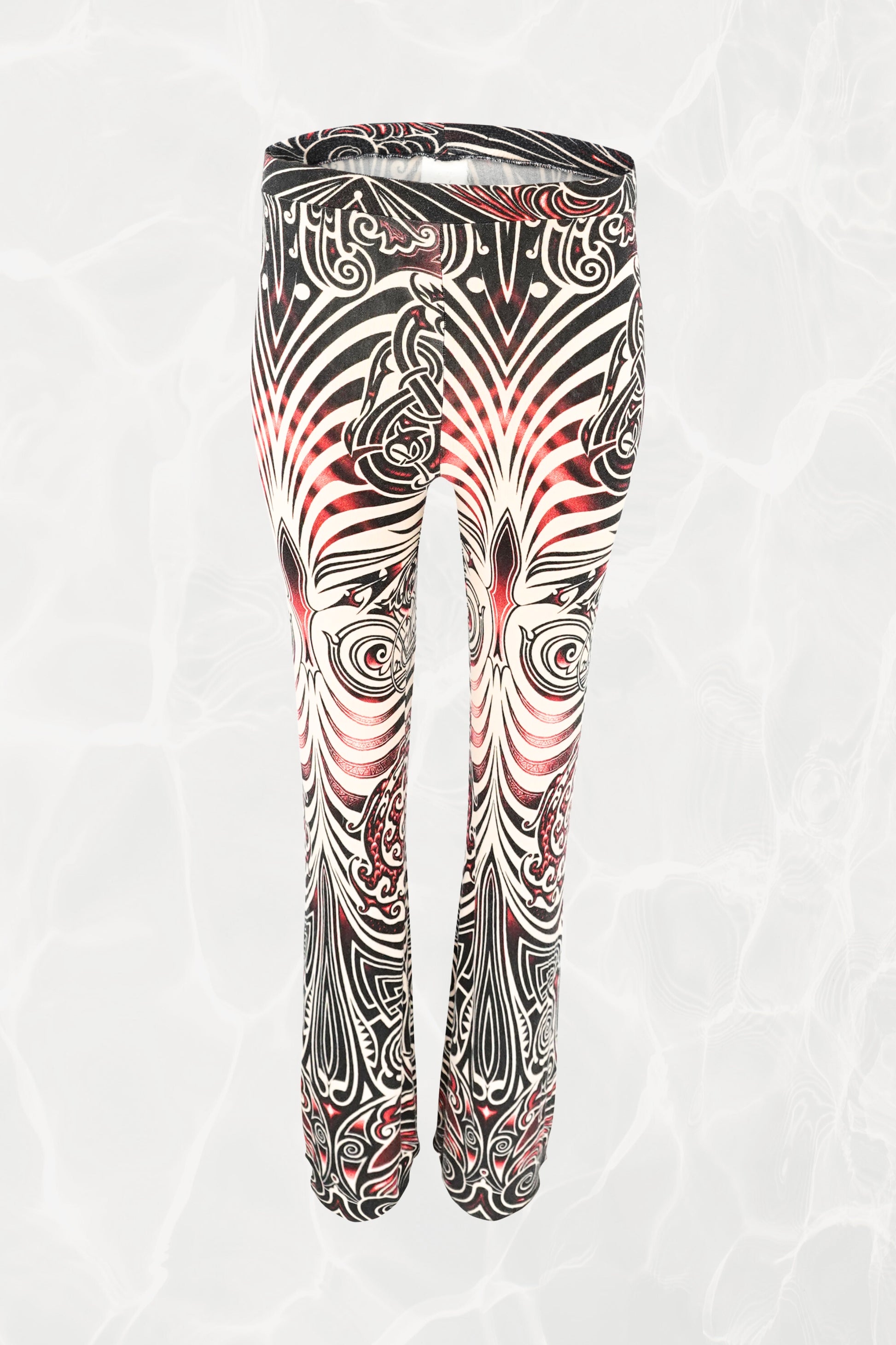 Jean Paul Gaultier JPG Jeans SS96 Cyberbaba pull-on pants front view: full-length jersey knit trousers with tribal tattoo print in black, white and red, circa 1996