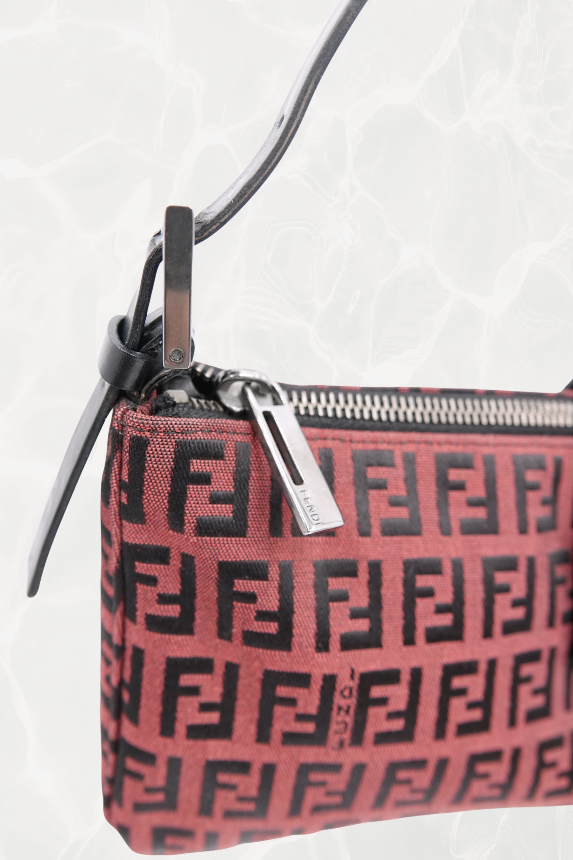 Fendi Zucchino FF monogram baguette, side view showing zipper and zipper pull — Disco Palma