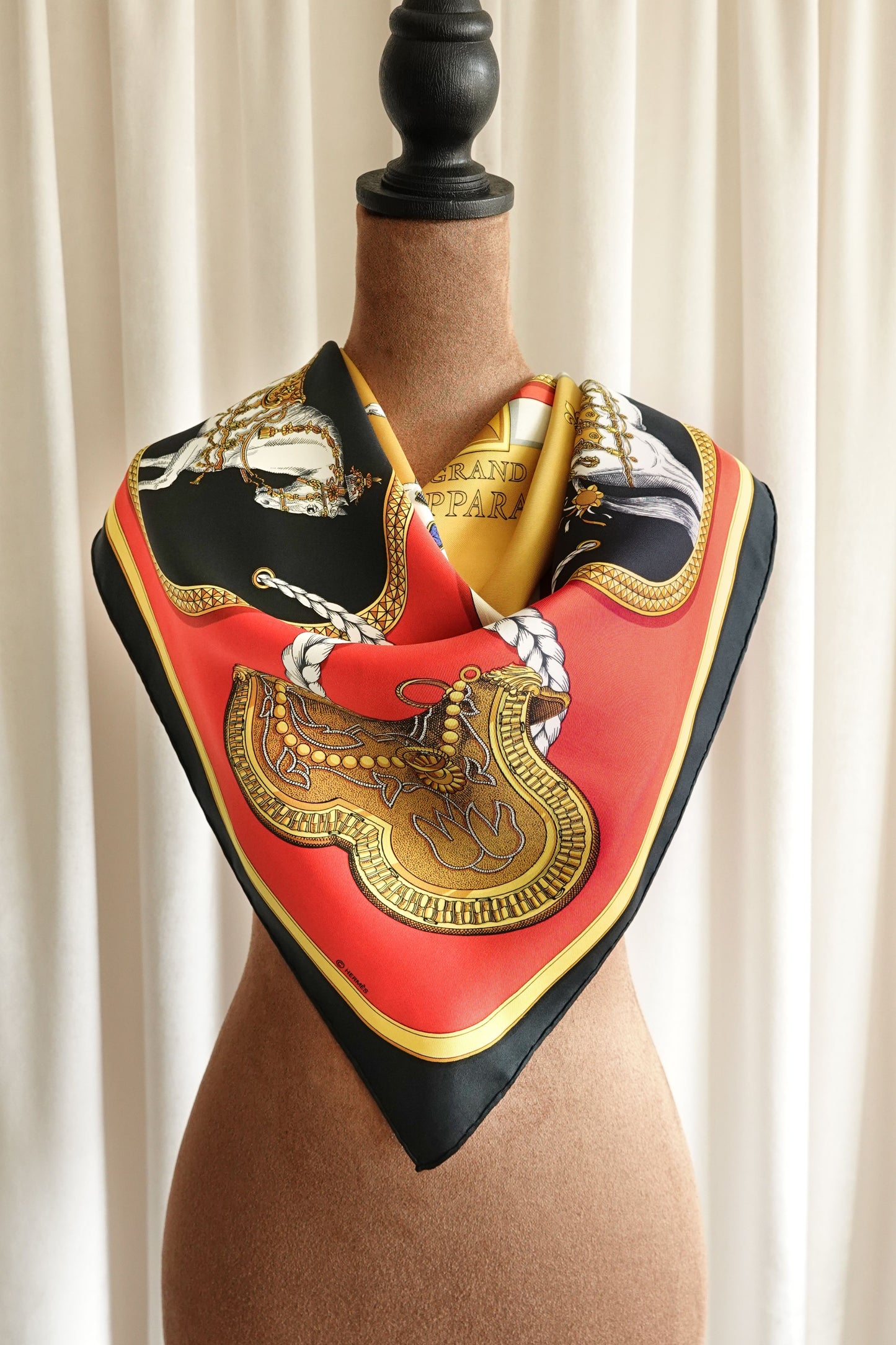Hermès Grand Apparat Carré 90 silk scarf on mannequin, full view showing equestrian motif and gold border