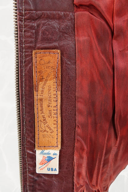 East West Musical Instruments 1970s burgundy leather jacket, detail of collar and zipper — Disco Palma