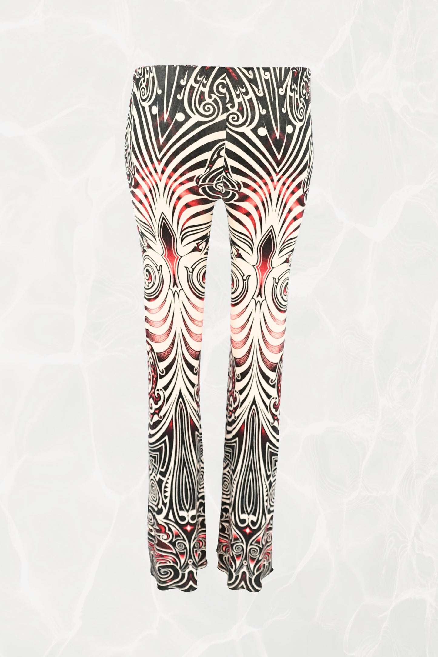 Jean Paul Gaultier JPG Jeans SS96 Cyberbaba pull-on pants back view: jersey knit trousers with swirling tribal tattoo print in black, white and red, 1996