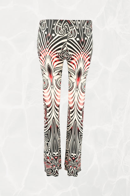 Jean Paul Gaultier JPG Jeans SS96 Cyberbaba pull-on pants back view: jersey knit trousers with swirling tribal tattoo print in black, white and red, 1996