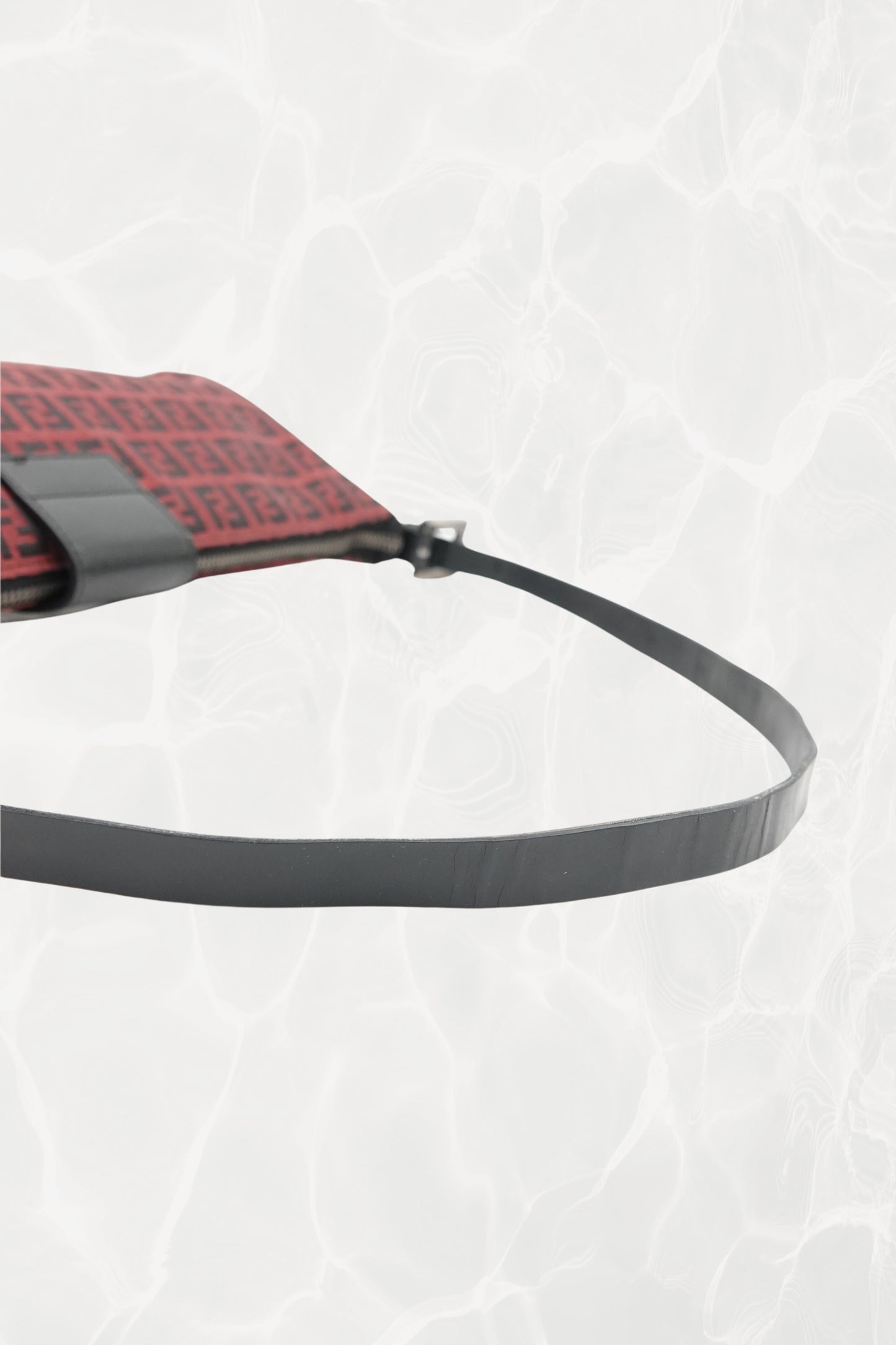 Fendi Zucchino FF monogram baguette, black leather strap showing age-consistent wrinkling — Disco Palma