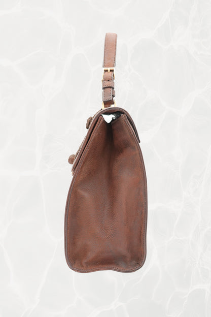 Gold-tone turn-lock closure detail on vintage Prada Antic Passamane bag