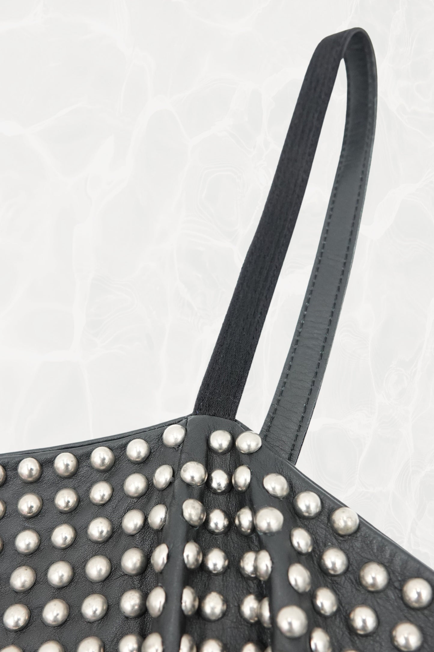 Loewe by Narciso Rodriguez AW01 studded leather dress full length: complete view of architectural silhouette contrasting all-over metal-studded fitted leather corset bodice with voluminous paneled silk flare skirt, AW2001