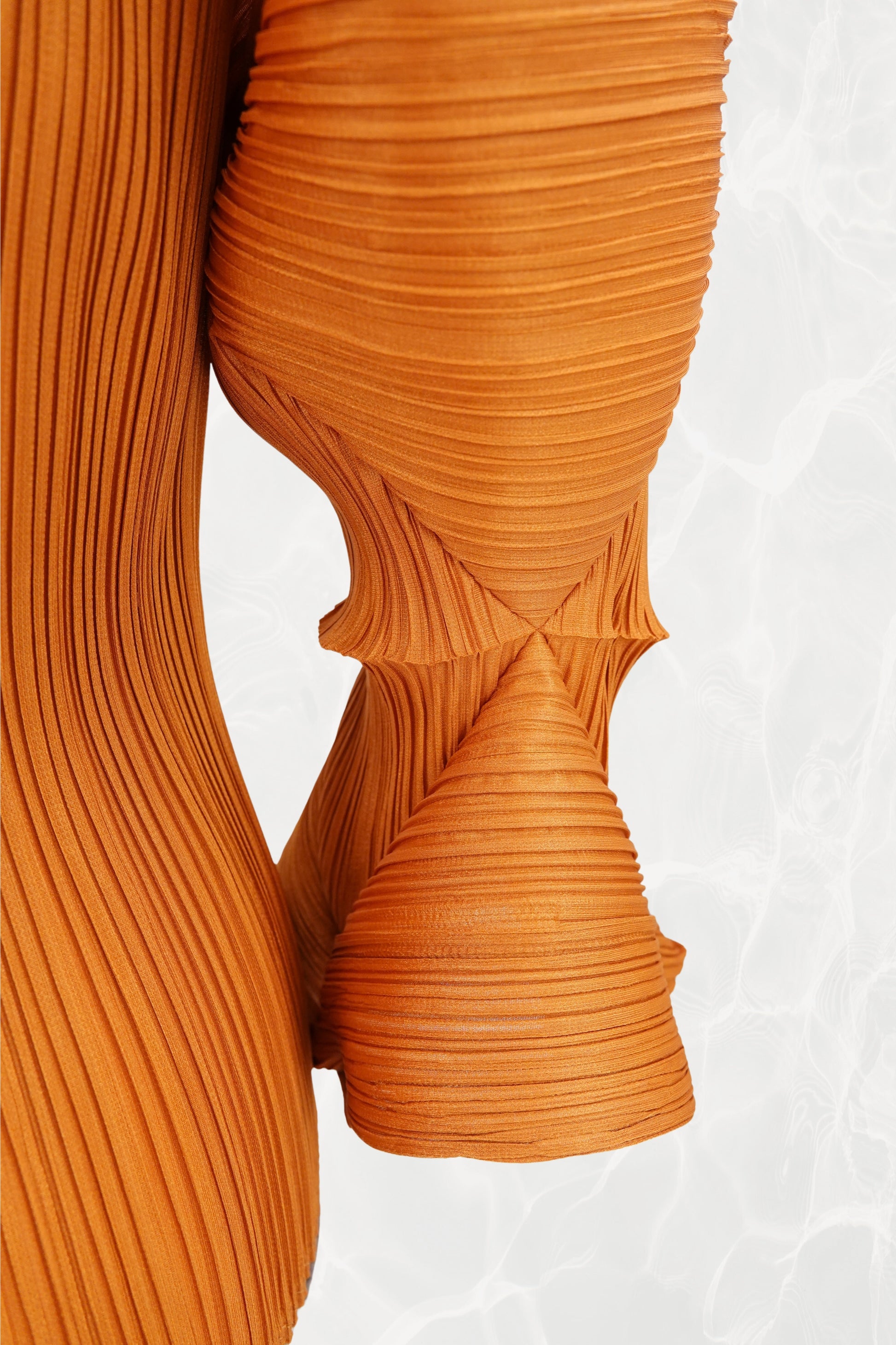 Issey Miyake Pleats Please marigold top, label and hem detail — Disco Palma