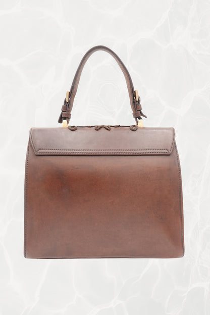Top handle detail on vintage 1990s Prada goat leather bag