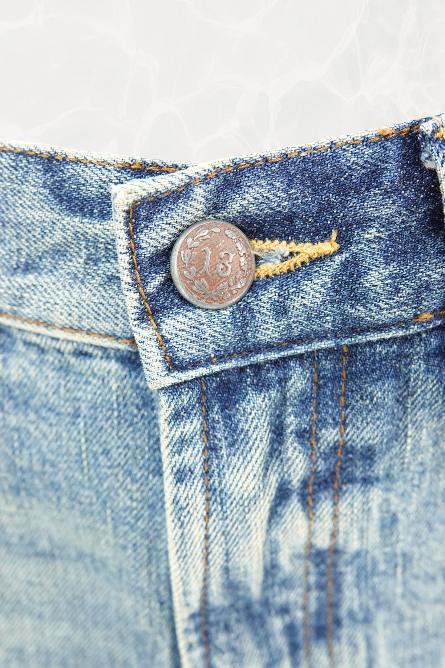R13 faux-leather patch label and orange topstitching at waistband — Disco Palma