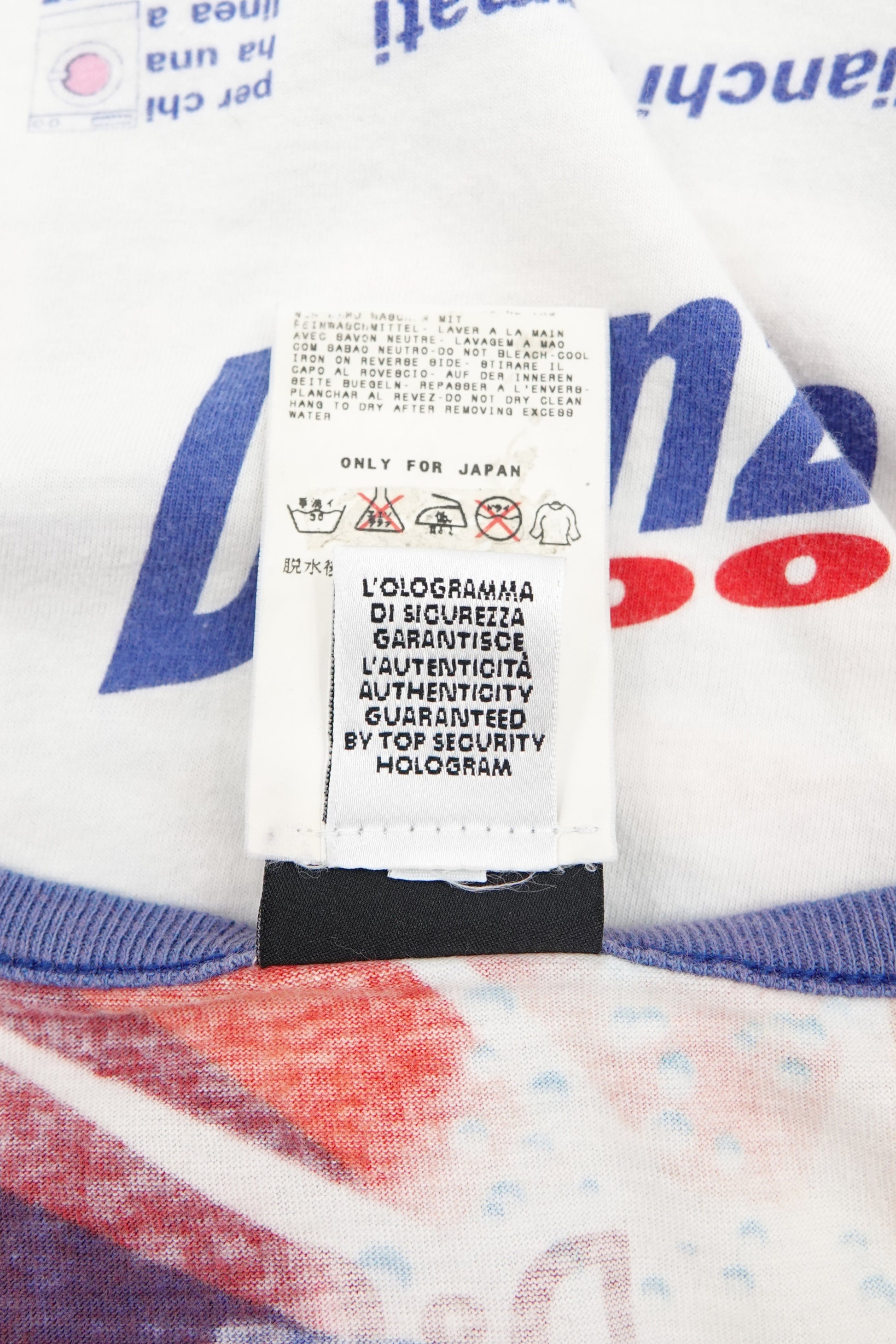 D&G SS02 authentication label close-up: D&G top security hologram authenticity tag and care label reading "Only for Japan", on Danza 3000 graphic print jersey knit
