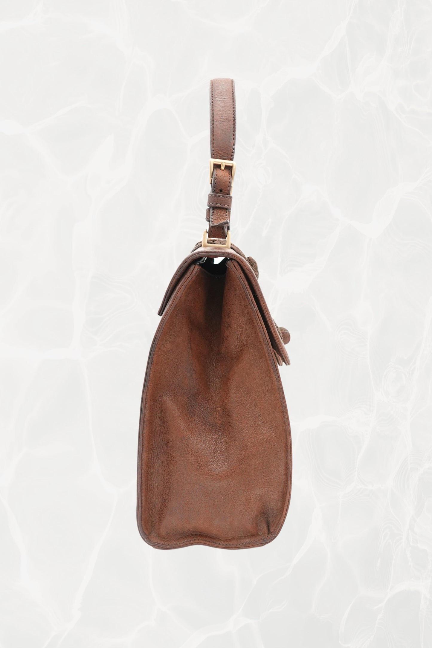 Interior amber leather lining of vintage Prada Antic Passamane bag