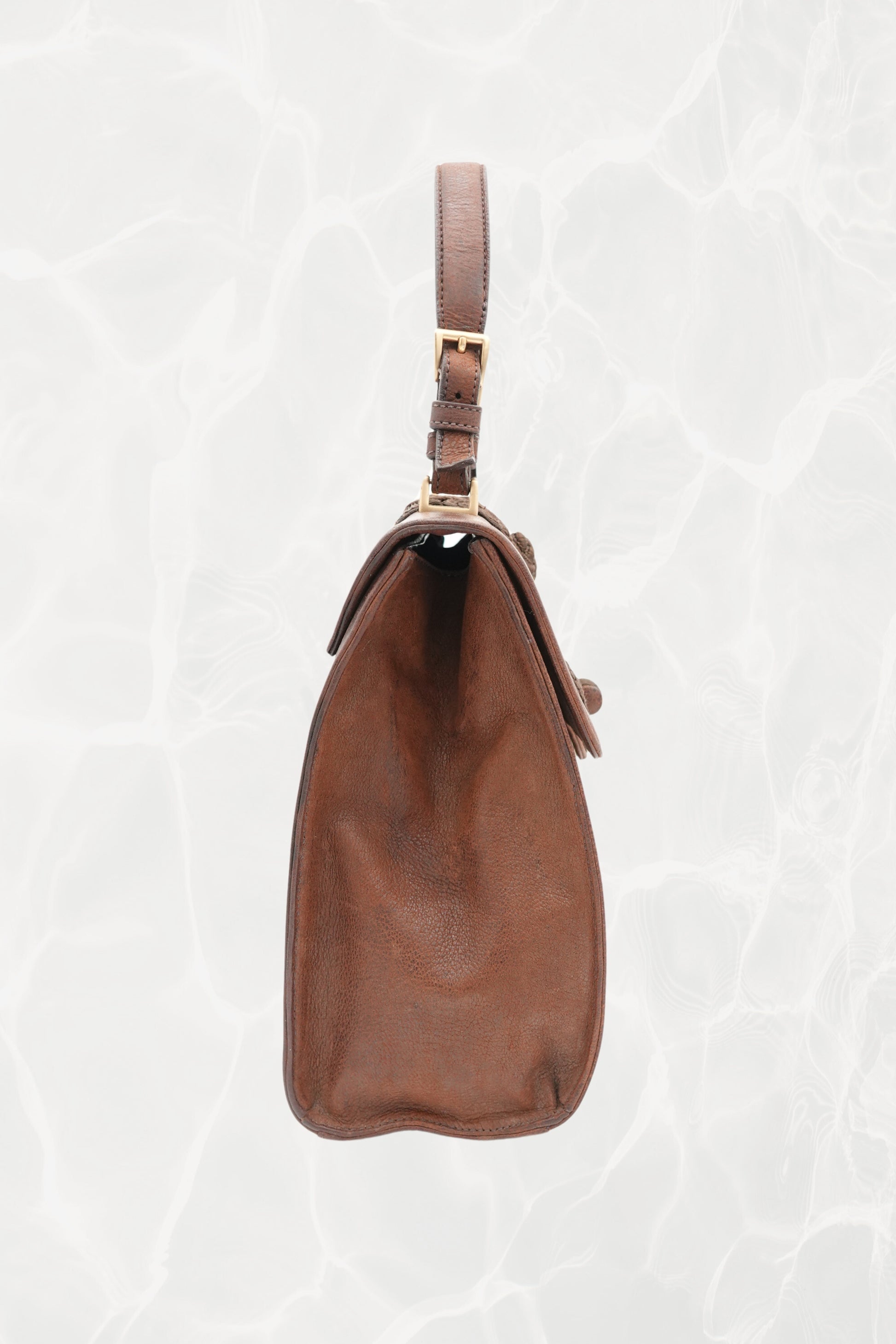 Interior amber leather lining of vintage Prada Antic Passamane bag