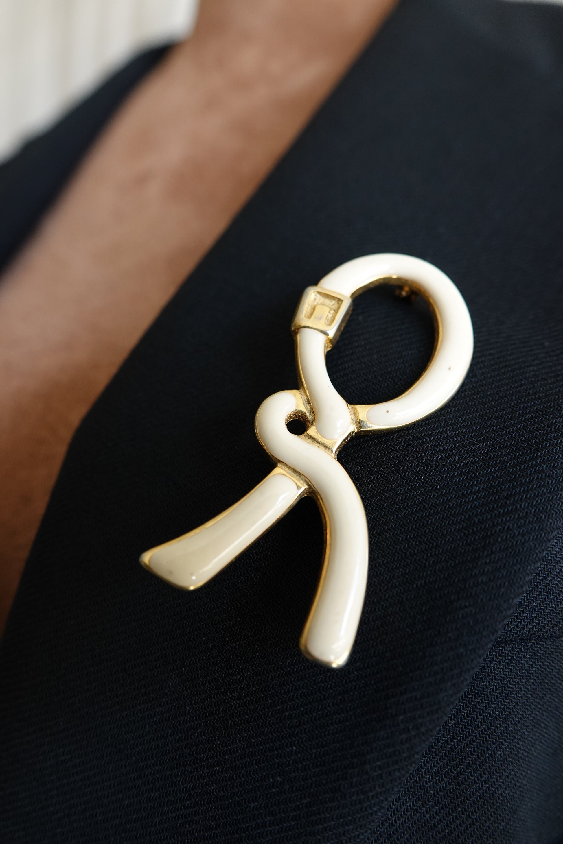 1980's Cream & Gold Enamel Ribbon “R” Logo Brooch
