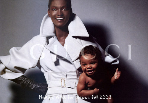 Tom Ford for Gucci AW03 white wool angora corset coat in original Gucci Fall 2003 advertisement: model wearing coat with corset belt and GUCCI logo overlay, Gucci Fall 2003 campaign