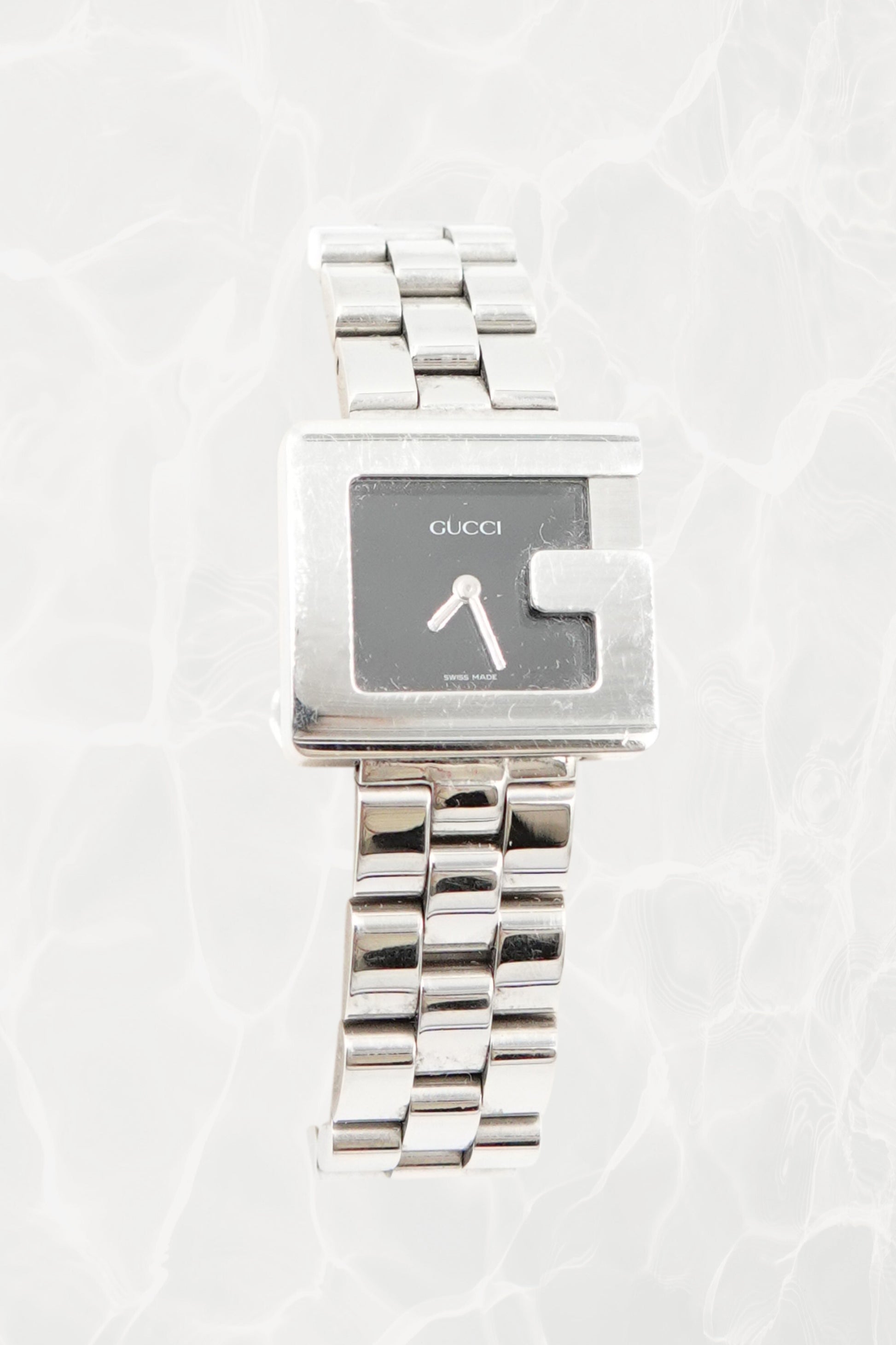 Tom Ford for Gucci G-Frame watch, three-quarter angle showing rectangular case and multi-row bracelet